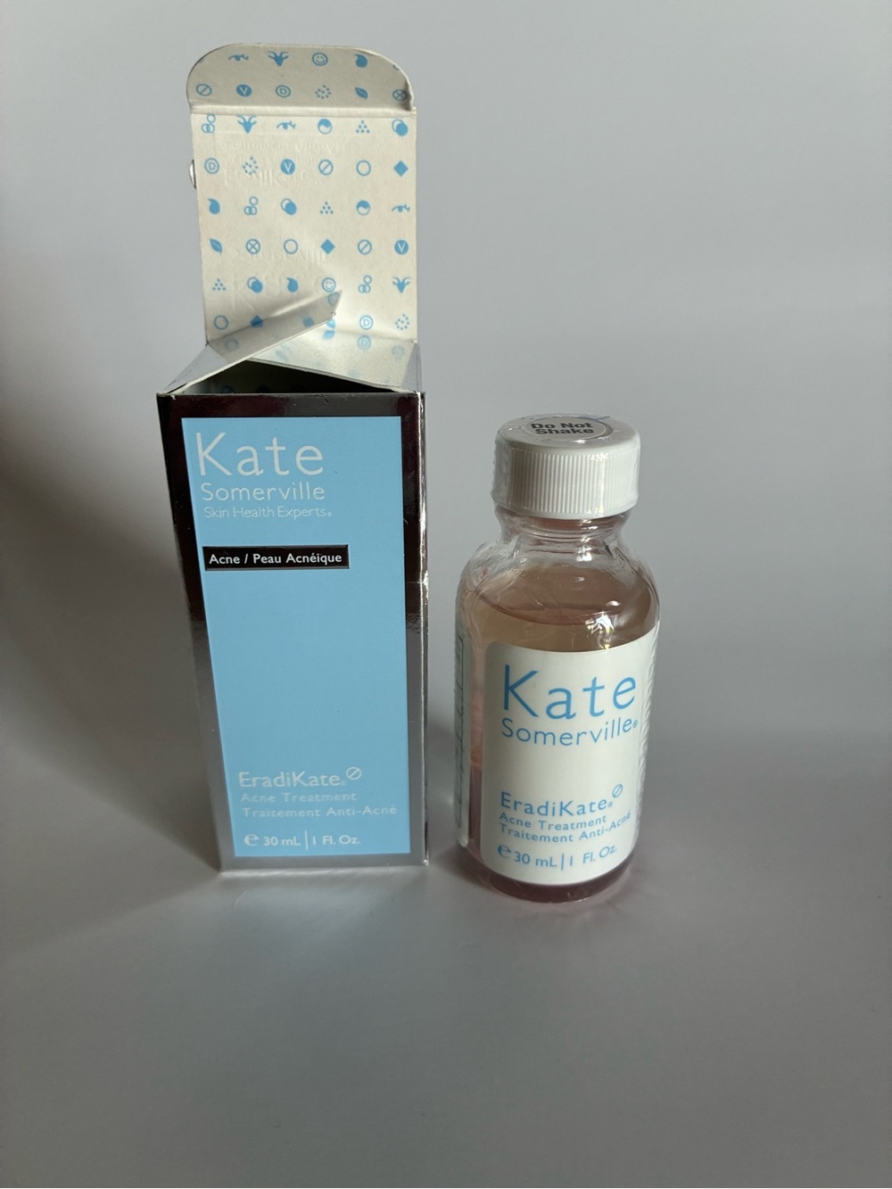 Kate Somerville Acne Treatment Bottle and Box - Light Blue, White